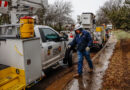 A photo of CPS Energy crew working in freezing rain to restore power